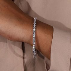 Close-up of diamond bangle bracelet with tab prongs Moissanite Vs Diamond, Diamond Bangle Bracelet, Colored Diamond Rings, Round Diamond Setting, Antique Diamond Rings, Diamond Bangles Bracelet, Diamond Gift, Diamond Education, Wedding Ring Designs