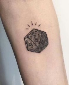 a black and white photo of a dice tattoo