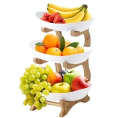 three tiered fruit trays holding various fruits