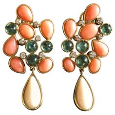 Earrings with 2 different kind of cabochon coral, sciacca and peaux d'ange drop, cabochon green tourmaline, diamonds, 18k gold gr.20. Total length is 4,5 cm weight 12,6. All Giulia Colussi jewelry is new and has never been previously owned or worn. Each item will arrive at your door beautifully gift wrapped in boxes, put inside an elegant pouch or jewel box. Coral Drop Earrings, Elegant Pouch, Red Coral Earrings, Wrap Earrings, Tourmaline Earrings, Yellow Gold Earrings, Tourmaline Jewelry, Coral Earrings, Earrings Diamond