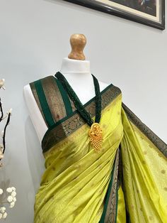 Discover the timeless beauty of our high-quality Banarasi saree, perfect for any occasion(wedding or parties). An apt pick for wedding or any kind of occasion. Very high quality, soft and pleats well. This set is completed with an unstitched blouse fabric. Festive Green Pre-draped Saree With Zari Weaving, Green Dola Silk Pre-draped Saree For Diwali, Green Pre-draped Saree With Zari Weaving For Diwali, Green Paithani Silk Pre-draped Saree With Self Design, Green Chanderi Pre-draped Saree For Puja, Green Pre-draped Saree With Self Design For Diwali, Green Art Silk Elegant Lehenga, Elegant Green Art Silk Lehenga, Festive Green Paithani Silk Pre-draped Saree