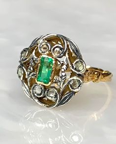 Oval Emerald Ring, Vintage Emerald Ring, Rose cut Diamond Ring, Emerald Gold Ring, Antique Emerald Ring, Emerald Leaf Ring, OOAK Ring A pleasing unusual 18k yellow gold one of a kind piece featuring a 0.80 carat emerald cut Emerald surrounded by rose cut diamonds accented with genuine silver. *Approximate ring weight: 5.65 grams * Ring size: US 8 1/2 Luxury White Gold Emerald Ring With Rose Cut Diamonds, Heirloom Oval Emerald Ring With Rose Cut Diamonds, Luxury Emerald Ring With Rose Cut Diamonds For Anniversary, Oval Emerald Ring With Single Cut Diamonds For Anniversary, Oval Emerald Ring With Single Cut Diamonds, Antique Green Diamond Ring With Rose Cut Diamonds, Antique Green Diamond Ring With Rose Cut, Luxury Emerald Rings With Rose Cut Diamonds, Victorian Emerald Ring With Rose Cut Diamonds