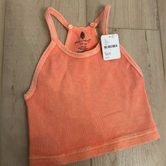 Never Worn With Tags Work Out Top Trendy Orange Workout Top, Casual Pink Racerback Top, Pink Ribbed Racerback Top, Casual Pink Racerback Tank Top, Pink Racerback Top For Spring, Trendy Pink Sports Crop Top, Casual Fitted Peach Tank Top, Fitted Casual Peach Tank Top, Pink Racerback Crop Top For Spring