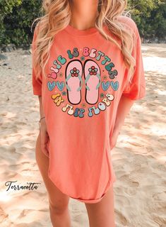 "Discover our Sun-Kissed Comfort Color Shirts, the ultimate summer wardrobe essential, designed to enhance your beach vibes and create unforgettable summer memories! Featuring a range of eye-catching designs inspired by sun-soaked beaches, tropical paradise, and endless summer adventures, our shirts will have you daydreaming about your next beach escape. Dive into a world of surf, sand, and salty sea breeze with our vibrant collection of t-shirts that embrace the aloha spirit and coastal living Spring Vacation T-shirt With Crew Neck, Casual Beach T-shirt For Warm Weather, Summer Short Sleeve T-shirt For Warm Weather, Summer Orange Cotton Shirt, Orange Cotton Summer Shirt, Fun Summer T-shirt With Text Print, Summer Beach Shirt With Short Sleeves, Orange Vacation Shirt For Spring, Spring Vacation Orange Shirt