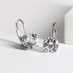 Timeless beauty, Forever a classic. Two round brilliant moissanite stones sit effortlessly in four-prongs on these lever-back earrings. Features Moissanite was originally found in meteorites(Chemical name: Silicon Carbide). It was first discovered in 1893, while a scientist was examining meteor samples from a crater in Arizona. After many years, ReadYourHeart experts has been recreated moissanite in the laboratory, that make the gemstone with friendly, and has eternal shining like stars. ReadYou Beauty Forever, Silicon Carbide, Moissanite Jewelry, Leverback Earrings, Timeless Jewelry, Stone Cuts, 2 Carat, 1 Carat, Round Brilliant