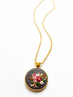 ARIA'S HAND EMBROIDERED WILDFLOWERS NECKLACE Nothing brightens a day like flowers do. So here's some flowers you can wear everyday to bring some cheer to your day and outfit. It never wilts plus it's a conversation piece too! I hand embroider every intricate piece, and each pattern is hand drawn so no two necklaces will be exactly the same. This necklace is proudly handmade in the Philippines. - - - - - - - - - - - - - - - - - - - - - - - - - - - - - - - - - - - - - - - - - - - DETAILS: * Pendan Bohemian Embroidered Jewelry For Wedding, Bohemian Flower Pendant Necklace For Wedding, Floral Embroidered Flower Jewelry For Weddings, Bohemian Wedding Necklaces With Flower Charm, Embroidered Wildflowers, Boho Embroidery, Tiny Pendant, Wedding Anniversary Gift, Necklace Boho