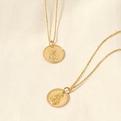 This stunning Mary & Jesus Necklace is a beautiful symbol of faith and devotion. It is a timeless keepsake that will be cherished for years to come. Its simple yet eye-catching design makes it the ideal accessory for any occasion. Let this Mary & Jesus Necklace grace your neck as a reminder of your spiritual journey. - Made in 14k solid gold - Pendant Diameter: 15.80 mm / 0.62 inches - Pendant Thickness: 0.76 mm / 0.03 inches - This product comes with iconic Norm Jewels gift box Spiritual Medallion Necklace For Anniversary, Classic Wedding Necklaces With Charms, Classic Wedding Necklace With Charms, Timeless Charm Necklace As A Gift, Spiritual Polished Wedding Necklaces, Timeless Charm Necklace For Gifts, Classic Tarnish Resistant Coin Necklace For Gift, Classic Tarnish-resistant Coin Necklace For Gift, Timeless Charms Necklace For Anniversary