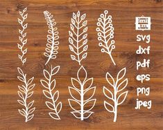 the stencil set includes different types of plants and leaves on a wooden surface