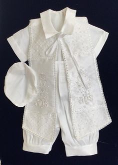 Baptism boys outfit  Popular style for Christening ceremony the outfit comes in white or ivory with short sleeve embroidered shirt  and comfortable suspender cuff pants. Stylish embroidered stole with pearl cross and matching bonnet included will make your little one look so special CANDEL SET IS NOT IN CLUDED WE DO HAVE MACHINENG  CANDEL SET Embroidered Fitted Baptism Dress For Summer, Fitted Embroidered Baptism Dress For Summer, Fitted Embroidered Sets For Baptism, Summer Embroidered Fitted Baptism Dress, Elegant Embroidered Baptism Sets, White Short Sleeve Set For First Communion, White Short Sleeve Sets For First Communion, Fitted White Baptism Dress With Pearl Embroidery, White Spring Sets For First Communion