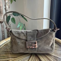 Authentic Fendi Baguette. Militare Suede Material. In A Very Good Vintage Condition. So Stains Or Rips. Inside Is Clean. 10” Length. 6.5” Height. Dm Me For More Photos And Questions. No Return Or Exchange Final Sale Fendi Baguette, Suede Material, Fendi Bags, Dm Me, More Photos, Final Sale, Fendi, Bag Lady, Shoulder Bag