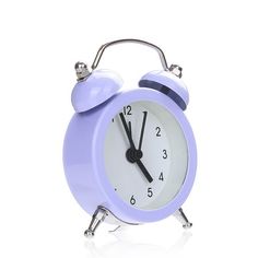 a purple alarm clock on a white background with no time left to tell it's five o'clock