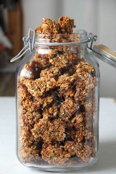 a jar filled with granola sitting on top of a table