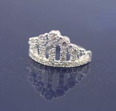 This Beautiful and Sweet Crown Ring With Cz, its made with high quality Sterling Silver 925 Its perfect for anyone any age for any occasions, a great gift for that special someone or yourself. Item Specifications: Item: PACOR4 Metal Type: Sterling Silver Metal Stamp:925 Style: Ring Style: Crown Stone: Multiple CZ Ring Height : 1/2 inch ( approx 13mm) * We only sell SOLID metals Stamp: 925 Sterling Silver. We do NOT Silver plate our Jewelry More Woman Ring: https://www.etsy.com/shop/Alyssasdreams Silver Rings With Prong Setting For Birthday, Elegant Rings With Diamond Accents For Birthday, Elegant Diamond Ring For Birthday, Wedding Diamond Ring With Sparkling Stones, Elegant Diamond Birthday Rings, Elegant Silver Rings For Birthday, Wedding Diamond Ring With Sparkling Stones In Sterling Silver, Sterling Silver Crown Shaped Elegant Rings, Silver Ring With Crown Design