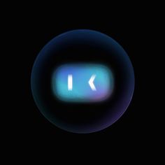 a blue button with the letter k in it's center on a black background