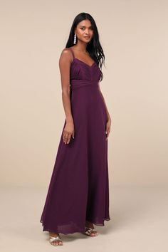 a woman in a long purple dress