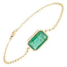 This Emerald May Birthstone Chain Bracelet in 18K gold showcases endlessly sparkling natural emerald, weighing 2.47 carat. It measures 7.5 inches long in length. Emerald enhances intellectual capacity of the person. Designed with perfect octagon cut emerald set in bezel setting in gold to make you stand out on any occasion or event. The elegant style complements the attire beautifully and is a perfect Engagement Gift, Bridal Shower Gift, Grandma Gift, Gift For Sister, Mother Gift, Bride To Be Gi May Birthstone Jewelry, Perfect Engagement Gifts, Emerald Set, Mom Wedding Gift, Modern Bracelets, Mom Wedding, Birthstone Bracelet, Bracelet Women, May Birthstone