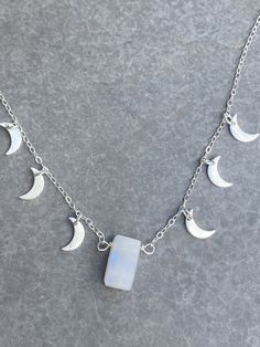 "Moonstone intensifies your feminine goddess energy within. Moonstone is used as a stone of the moon to call in abundance every day. Abundance is always here. The crescent moon means 'to bring forth'. A powerful duo of moon symbols, this necklace channels your divine feminine. I dreamed about this necklace and now, here it is. You can't take your eye off her. She dances as you move, all her little moons sparkling and shining as you spread your light. Wear it and channel abundance in every moment Ethereal Moon Phase Necklace For Gift, Ethereal Moon Phase Necklace Gift, Mystical Moonstone Necklaces For Meditation, Healing Moonstone Necklaces With Moon Charm, Healing Moon Phase Pendant Crystal Necklaces, Silver Celestial Crystal Necklace With Moon Charm, Moonstone Necklace With Moon Charm For Meditation, Mystical Moonstone Necklace For Meditation, Healing Moonstone Crystal Necklace With Moon Phase