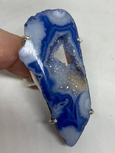 great color blue Lace agate stone The setting is handcrafted in low content silver About 2 inch long Size 6.5 Can be sized. My jeweler charges between $10-$15. All rings are shipped free in the US in a nice gift box. Check out our over a THOUSAND great reviews Engraving is $4 per letter and is not always perfect depending on the piece. It can take a few days if the jeweler is busy. This is payable to Paypal Judithsltd@gmail.com Blue Agate Geodes With Natural Stones, Blue Agate Geodes, Blue Oval Agate Jewelry, Oval Blue Agate Jewelry, Blue Rings With Large Stone For Healing, Unique Blue Natural Gemstones, Artisan Blue Ring, Artisan Blue Rings One Of A Kind, Handmade Blue Agate Rings