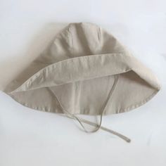 Nothing embodies summer quite like a wide-brimmed, floppy hat. But, this is no ordinary sun hat! Mindfully made from the softest organic linen and designed with a soft structured brim, it’s simply the most stylish way to shade your eyes (it even has a handy chin tie for breezy beach days). GOTS certified and free from harmful chemicals, our organic linen is luxuriously airy. It’s sourced from rare organic flax from the mountains of France to retain its durable, rustic appearance yet incredibly s Cotton Sun Hat For Everyday Use, Solid Cotton Sun Hat For Everyday, Solid Color Cotton Sun Hat For Everyday, Everyday Cotton Sun Hat, Summer Linen Fedora Hat, Vacation Linen Hat With Short Brim, Summer Linen Hat With Short Brim, Summer Linen Hat With Curved Brim, Linen Fedora Hat For Spring