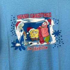 a blue t - shirt with an image of spongebob and santa clause on it