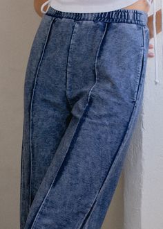 A wide length pant with pintuck detailing down the front to elongate the leg. Tailored to sit right above the ankle. Cut from an indigo twill. Details • Wide leg• Elastic waistband• Side and back pockets• Indigo dyedMeasurements based on size S• Waist: 29"• Inseam: "• Model is 5' 8". Wearing size XS. Fabric + Care • Indigo Twill - 55% Cotton / 40% Polyester / 5% Spandex• Machine wash in warm water with like colors. Do not bleach.• Tumble dry low.• Please note that indigo bleeds for the first few Fitted Bottoms With Seam Detailing And Cropped Leg, High-waisted Pants With Seam Detailing For Spring, Fitted Bottoms With Cropped Leg And Seam Detailing, Spring Cropped Leg Bottoms With Seam Detailing, Wide Leg Bottoms With Seam Detailing For Spring, Relaxed Fit Pants With Seam Detailing And Cropped Leg, Relaxed Fit Cropped Pants With Seam Detailing, Spring High Waist Pants With Seam Detailing, Spring High-waist Pants With Seam Detailing