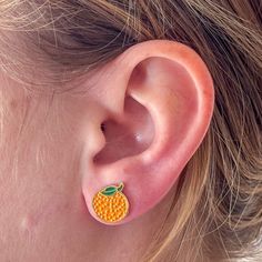 Add some fun to your jewelry game with our orange enamel studs! Perfect for food-loving fashionistas, these charming earrings bring personality to any outfit. Ideal for everyday wear, they showcase your individuality with a dash of sass. Hypoallergenic and measuring 0.5" long, these studs are an original Jenny Lemons design. Get ready to stand out in style! Enamel Earrings, Vibrant Orange, Claw Clip, Hair Barrettes, Some Fun, Original Design, Hair Clips, Original Designs, Everyday Wear