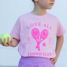 Introducing our pink Tennis Club tee! This print is the perfect addition to our T-shirt, giving it texture and pop. We know you’ll love this tee as much as we��’ll do! Glenda The Good Witch, Kids Going To School, Purple Books, Pink Tennis, Rainbow Tutu, Pink Charm, Dress Up Day, Tennis Club, Tennis Clubs