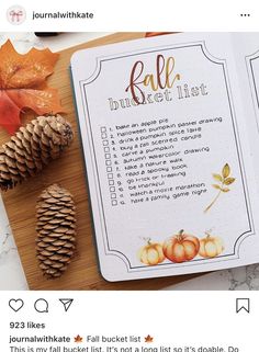 the fall bucket list is next to some autumn leaves and pine cones on a cutting board