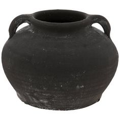 an old black vase is shown on a white background