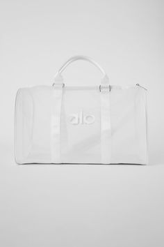 For a weekend trip to the desert or an all-day hang at the beach, this duffle makes your bag the main character. It has an on-trend, see-through design plus a slew of functional features, like a flat bottom (so it stands without slouching or sagging), a top zipper, comfortable top handles and a detachable shoulder strap. White Weekender Bag With Luggage Sleeve, Everyday Nylon Bag With Mesh Lining, White Duffle Bag With Large Capacity For Weekends, White Large Capacity Duffle Bag For Weekend, White Functional Weekender Bag With Luggage Sleeve, White Mesh Travel Bag, Nylon Weekend Travel Bag, Nylon Travel Bag With Clear Strap, Summer Travel Bags With Mesh Lining