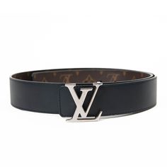 100% Authentic  The bold style and stunning detailing of this Louis Vuitton belt make it a fabulous fashion accessory. It has the classic Louis Vuitton monogram on coated canvas and reverses to black leather with a buckle that is a silver Louis Vuitton LV logo. Wear this with chic denim or layered looks for an added touch of luxury. Length: 43.00 in Height: 1.50 in Excellent Condition OQS530057 NM9.11.24 Known for its impeccable style and quality, the Louis Vuitton brand is one highly admired by Silver Louis Vuitton, Lv Logo, Logo Wear, Louis Vuitton Black, Denim Chic, Louis Vuitton Belt, French Designer, Reversible Belt, Lv Monogram