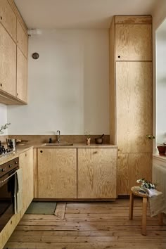 a kitchen with wooden cabinets and an oven