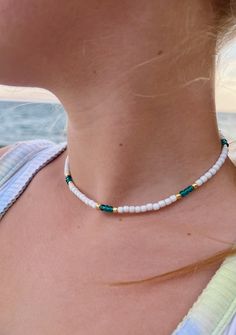 White seed bead choker necklace with an aqua/turquoise blue pattern and gold accents. Necklace length is adjustable by tightening or loosening sliding knot closure. necklace length is 13 inches fully tightened or 26 inches when fully extended. This necklace is waterproof and perfect for a day at the beach or the pool! Cheap Beach Necklace With Dangling Beads, Pink And Green Beaded Necklace, Blue Necklace Beads, Diy Seed Bead Necklace, Beach Beaded Necklace, Seed Bead Necklace Ideas, Beaded Neckalce, Tropical Necklace, Seed Bead Choker