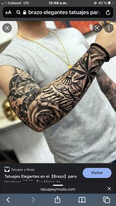 a man with a black and grey tattoo on his arm