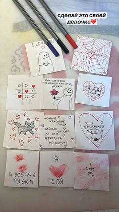 several cards with drawings on them and two pencils next to one that says i love you