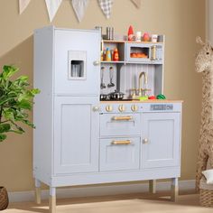 a child's play kitchen with an oven and sink