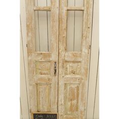 an old pair of double doors with chalkboard on the front and side panels that say love