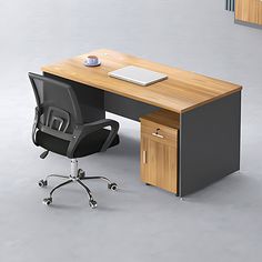 an office desk with a laptop on it and a chair in front of the desk