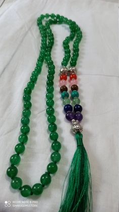 108 Beads Natural green onyx Japa Mala Prayer Beads semi-precious Gemstone Round Beads // Long Tassel Necklace// Meditation japa mala // Guru bead// Necklace Yoga Beads green Color // 8 mm Bids size - 8mm approx 40 inch seven chakra necklace color - green It is known as the 'love stone' as the message it emits is the strong vibration of unconditional love, joy, warmth and healing. As quartz crystals are profound amplifiers of energy, it may help to kindle happiness, love, romantic feelings and s Spiritual Green Beaded Bracelets With Colorful Beads, Bohemian Green Agate Beaded Necklaces, Bohemian Green Agate Beaded Necklace, Beaded Agate Mala With Round Beads, Spiritual Green Malachite Beaded Bracelets, Green Malachite Spiritual Beaded Bracelets, Spiritual Green Beaded Bracelets, Adjustable Green Beaded Necklace With 8mm Beads, Adjustable Green Beaded Necklaces For Meditation