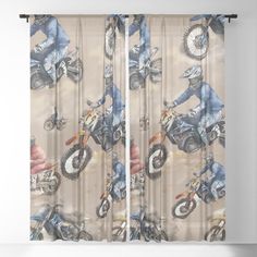 a window curtain with an image of a man on a dirt bike