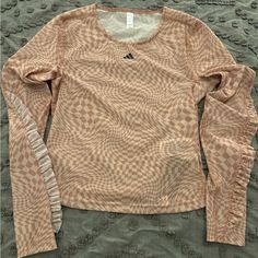 Women's Adidas, Sheer Top, Size S, Tags Attached, Unworn. Color Is A Mixture Of Peach And Nude. Very Fitted With Small Ruffles On The Sleeves. Spring Orange Stretch Tops, Adidas Stretch Long Sleeve Tops, Fitted Long Sleeve Orange Top, Adidas Long Sleeve Spring Tops, Adidas Long Sleeve Tops For Spring, Peach Stretch Top For Spring, Stretchy Peach Top For Spring, Sporty Orange Top For Spring, Adidas Fitted Summer Tops