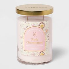 pink champagne candle with gold lid