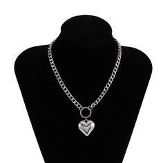 Unleash Your Edgy Side with a Touch of Elegance Step into the world of bold fashion with our Heart Pendant Punk Choker, a perfect blend of edgy punk style and feminine charm. This short-style necklace, designed for the modern woman, features a striking heart pendant hanging from a sturdy metal link chain. Its iron alloy construction ensures durability while offering a gleaming finish that captures the eye. Ideal for parties, casual outings, or adding a daring twist to your daily wear, this choke Heart-shaped Alloy Chain Necklace, Trendy Alloy Chain Necklace, Trendy Party Heart Choker Necklace, Trendy Heart Choker Necklace With Clavicle Chain, Trendy Heart Shaped Silver Chain Necklace, Trendy Heart-shaped Silver Chain Necklace, Valentine's Day Black Alloy Necklace, Black Heart-shaped Alloy Necklaces, Black Heart Alloy Necklace