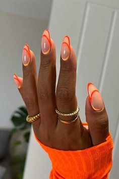 #StripedNails #NailArt #NailDesign #StripesOnNails #BoldNails #ChicNailArt #CreativeNails #NailInspo #FashionNails #StripedManicure Almost Nail Designs, Fun Orange Nails, Neon Fall Nails, Almost Nails, Hot Orange Nails, Orange Trendy Nails, Orange And Brown Nails, Orange Almond Nails, Fall Nails Orange