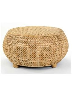 a round wicker foot stool with wooden legs and an oval seat on the top