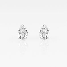 pair of diamond earrings on white background