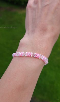 Introducing our Sparkling Blossom Pink White Crystal Daisies Bracelet, the perfect accessory to add a touch of summer elegance to your look. This handcrafted piece features faceted Czech crystal beads in beautiful shades of pink and white, arranged in a delightful daisy pattern. Product Details: Length: 23 cm (without the adjustable part: 18 cm) Bead Materials: Faceted Czech Crystal Beads Bead Size: 2 mm / 3 mm Chain Material: Silver Plated Copper (Nickel and Lead Free) Closure: Silver Plated Lo Delicate Adjustable Beaded Bracelets For Bridesmaids, Adjustable Delicate Beaded Bracelets For Bridesmaids, Dainty Beaded Bracelets With Round Beads For Bridesmaid Gift, Minimalist Beaded Bracelets For Bridesmaid Gift, Delicate Jubilee Beaded Bracelet As Gift, Minimalist Adjustable Beaded Bracelet For Bridesmaids, Dainty Pink Jubilee Bracelet, Adjustable Minimalist Beaded Bracelet For Bridesmaids, Delicate Beaded Bracelets For Friendship