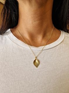 "For timely holiday delivery please choose expedited shipping in checkout. Happy holidays! Petal necklace - this unique gold leaf pendant necklace is delicate and beautiful. This botanical boho necklace is a perfect nature-inspired jewelry gift for a nature lover. This gold leaf necklace is inspired by petals and leaves. It has a delicate texture and a three-dimensional structure to achieve the look of a real leaf. This delicate leaf charm necklace will mix wonderfully with every outfit you choo Yellow Gold Leaf Shape Nature-inspired Jewelry, Minimalist Yellow Gold Leaf Jewelry, Leaf-shaped Yellow Gold Necklace For Gift, Nature-inspired Pendant Necklace As Gift For Her, Leaf-shaped Yellow Gold Necklace, Yellow Gold Leaf Necklace For Gift, Yellow Gold Leaf Necklace As Gift, Nature-inspired Leaf Jewelry Gift, Gold Leaf Nature-inspired Jewelry