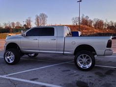 a silver truck parked in a parking lot