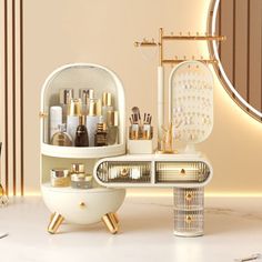 a white vanity with gold accents and makeup on the counter in front of a mirror